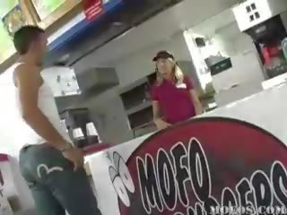 Enticing fast food worker gets down on her knees to blow two fellows