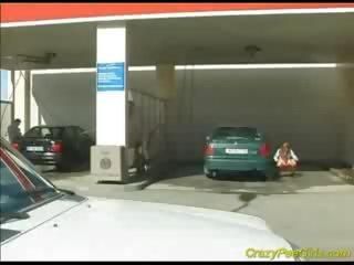 Gal Peeing in car washing