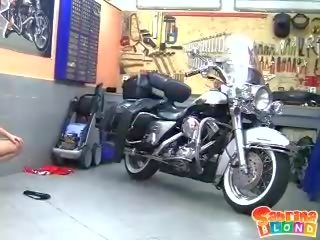 Lustful blonde teen with small tits stripping by the motor bike