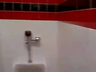 Cashier gives a random lad a public bathroom blowjob