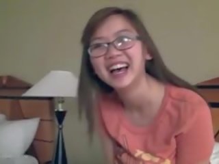Attractive Busty Asian girl Fngers In Glasses